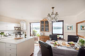 The kitchen/dining-room overlooks the water.