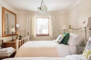 The twin bedroom looks into the private courtyard on the ground floor (Bedroom 1 ).