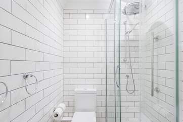 Bright white metro tiles in the shower rooms.