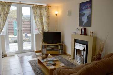 If the sun isn't shining, keep warm and toasty infront of the electric fire in the living room