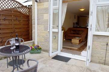 Patio doors lead from the sitting room into the rear garden