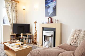 If the sun isn't shining, keep warm and toasty in front of the electric fire in the living room