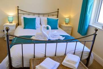The master bedroom has a large and very comfortable super king-size bed.