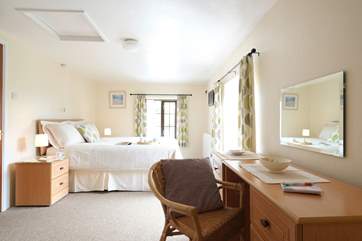 A lovely dressing area with walk-in wardrobe.