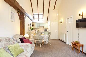 Sit back and relax in front of the TV in the light and airy sitting-room