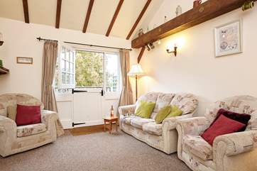 Cosy up on the sofa in the lovely sitting-room