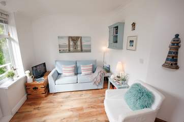 The living area is light and cosy to relax in.