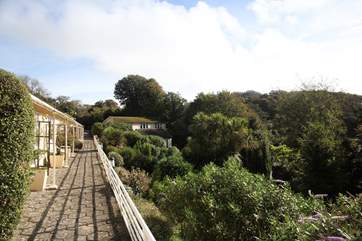 Surrounded by lovely landscaped gardens and woodlands