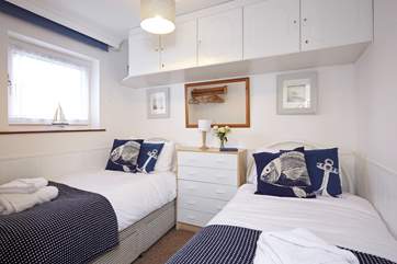 The nautical themed twin bedroom, is perfect for being right by the water