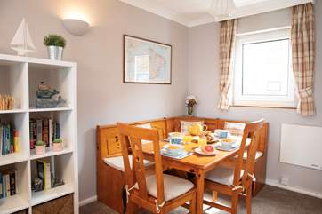 The comfortable sitting room, leads on to a bright dining area.