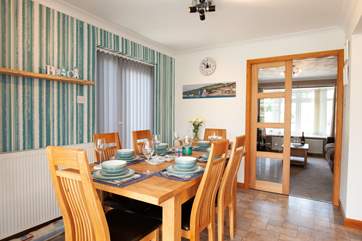 Boasting a sociable floorplan, the dining area leads out to a cosy sitting room.