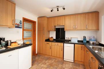 Modern and well-equipped, the kitchen offers ample cooking space.