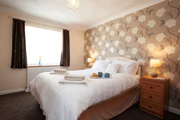 The master bedroom is comfortable and bright.