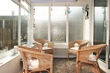 The conservatory is a lovely additional room to have your morning coffee looking out to the garden