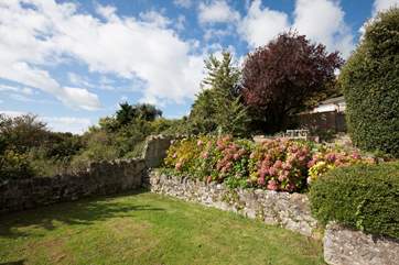 Make the most of the sunshine in the south-facing garden amongst the flowers