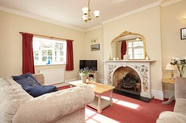 Keep warm in the cosy sitting-room with coal-effect, gas fire on a colder day