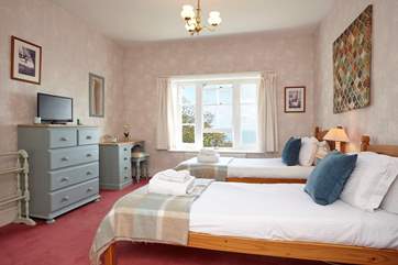 The twin bedroom is suitable for adults or children alike and has direct sea views through the window