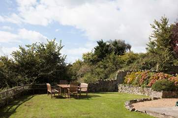 Dine al fresco in the south-facing garden over-looking the sea