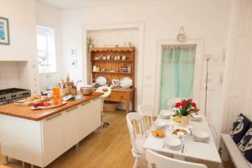 The kitchen is an utter delight with a charming Island separating the kitchen from the breakfast area
