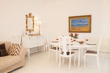 The open plan sitting room/ dining area is spacious and bright