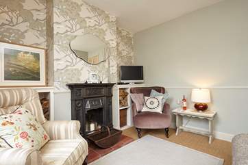The sitting-room has the original Victorian fireplace (ornamental).