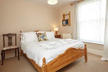 The second bedroom, located on the first floor also has an original Victorian fireplace.