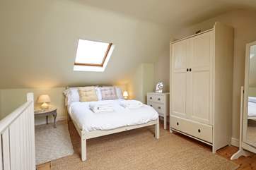 The beautiful master bedroom is the perfect escape for an afternoon nap.