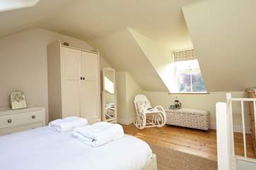 The master bedroom is light, airy and has ample space.