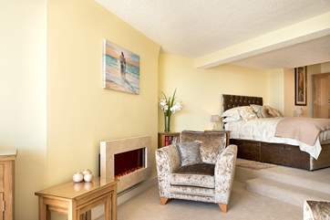 The bedroom area is accessed up a couple of steps from the sitting-area.