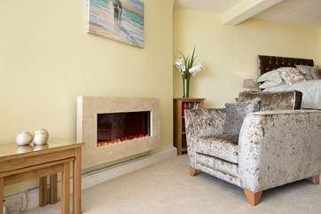 The wall-mounted fire creates a cosy glow making this an ideal retreat all year round.