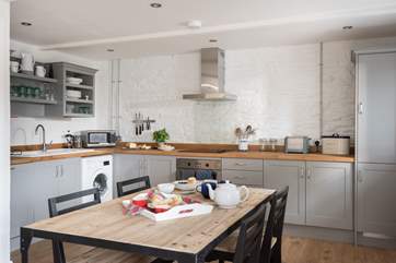 The kitchen area is spacious with plenty of room to dine.