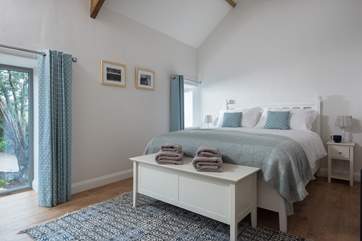 Both bedrooms have characteristic apex ceilings which add to the feeling of light and space.