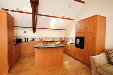The kitchen is well-equipped and is a delightful and characterful space to cook in