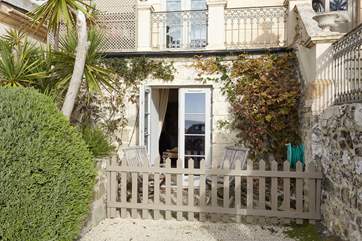 To the front of the property is a private terrace where you can sit, relax and look out to the beach and sea beyond