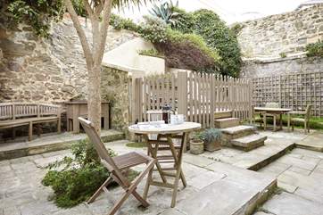 The courtyard to the rear of the property is fully enclosed