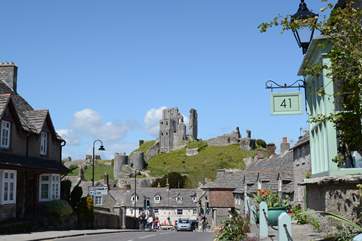 The National Trust's Corfe Castle on the Isle of Purbeck; the nearby coastline has sandy beaches that offer watersports hire during the summer season.