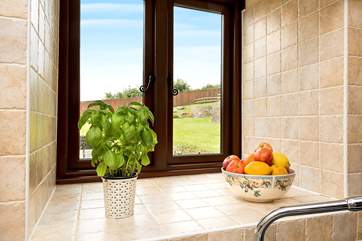 The kitchen looks out over the garden.