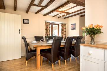Aldercombe Barn has a separate dining-room with patio doors leading out to the garden.