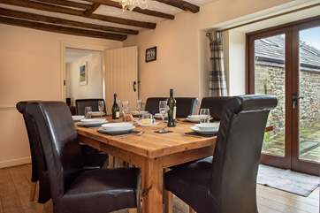 The dining room has patio doors leading out to the garden and terrace