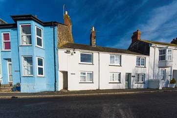 The Nutshell is the cottage to the right of the blue house.