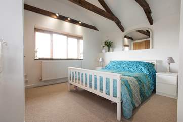 From the mezzanine bedroom area you can see across the neighbouring garage's rooftop to the 'Mount' with Mount's Bay in the distance.