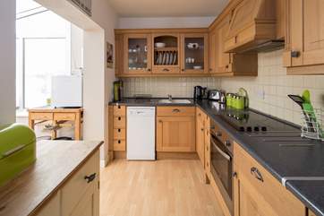 Well-equipped kitchen leading into the dining-room.