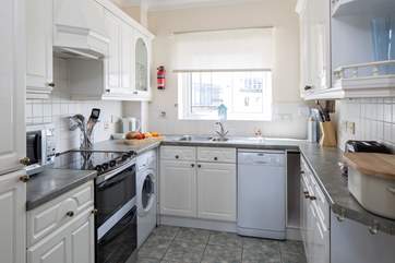 Bright and airy, well-equipped kitchen.