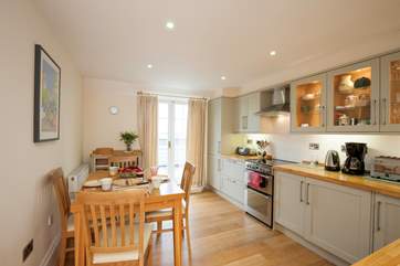 The delightful kitchen with patio doors out the balcony where you can enjoy your lunch in the sunshine