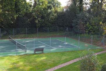 Play a spot of tennis on the shared courts