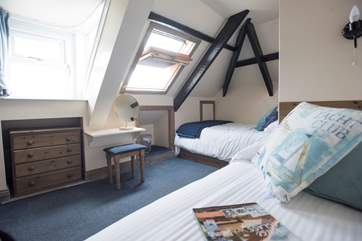 Views to the sea from this twin bedroom.