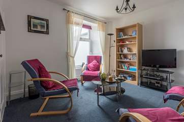 The sitting-room has lovely sea views.