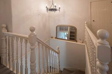 Twisted staircase leads up to the first-floor landing.