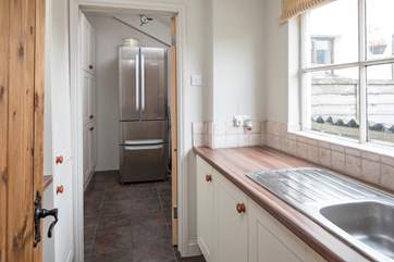 Large utility and storage-area. A great space to make a mess and shut the door to the rest of the house.