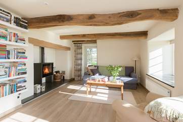 This is the informal living-room at the far end of the open plan kitchen/dining-room. The light comes flooding into this most sociable of spaces.